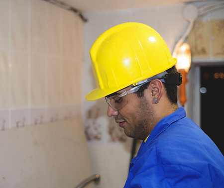 Construction worker with yellow helmetの写真素材