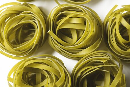 Background of vegetable spaghetti on white background. Italian pasta. Horizontal shoot.の写真素材