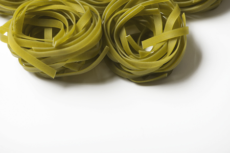 Background of vegetable spaghetti with copy space on white background.の写真素材
