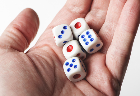 Dice on a hand. Isolated.