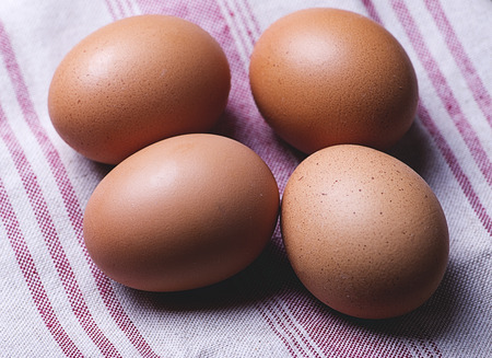 Eggs on tablecloth. Horizontal shoot.の写真素材