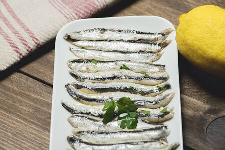 Close-up of anchovy dish with olive oil, vinegar and lemon.の写真素材