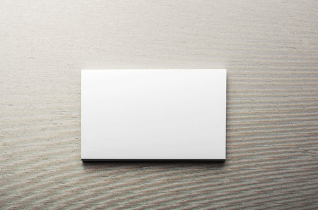 Business card, over gray background. Horizontal shoot.の写真素材