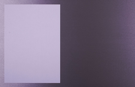 White sheet of paper on gray background. Horizontal shoot.の写真素材