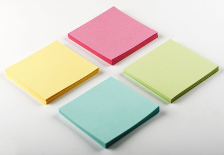 Stack of colorful paper notes on white background. Isolated.