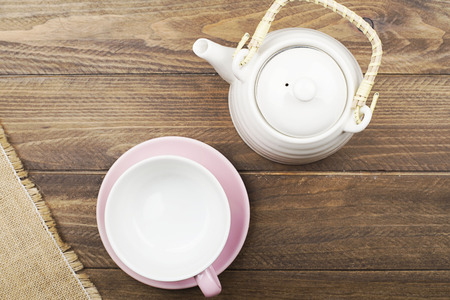 Background of napkin next to ceramic ware on wooden background. Copy space. Horizontal shoot.の写真素材
