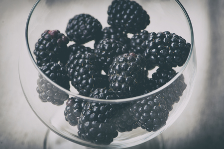 Close-up glass beaker full of blackberries.の写真素材