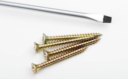 Screws and screwdriver on white background. Isolated.の写真素材