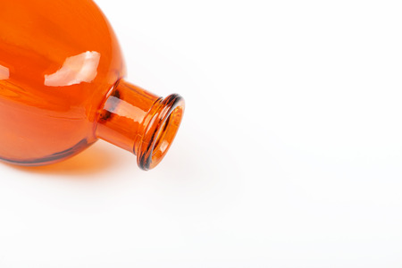 Close-up of orange glass jar on white background. Isolated. Container.の写真素材