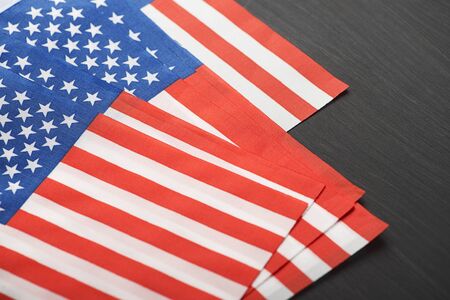 Studio shot of small bright USA flag on black background. Copy space.の写真素材