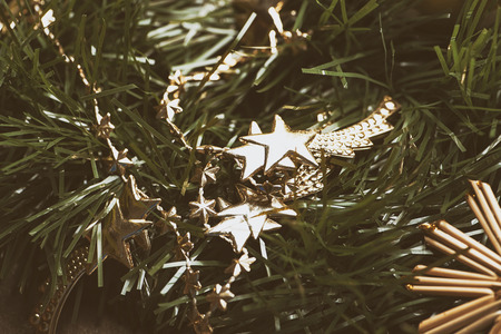 Christmas decoration with golden stars on Christmas tree.の写真素材