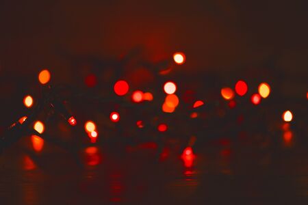 Christmas lights on wooden table.の写真素材