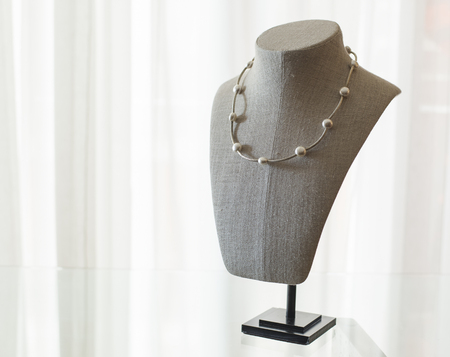 Exhibitor of jewels. Mannequin with pendant.の写真素材