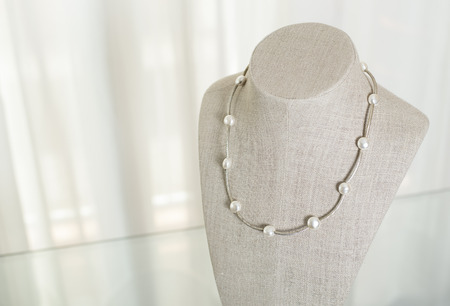 Exhibitor of jewels. Mannequin with pendant.の写真素材