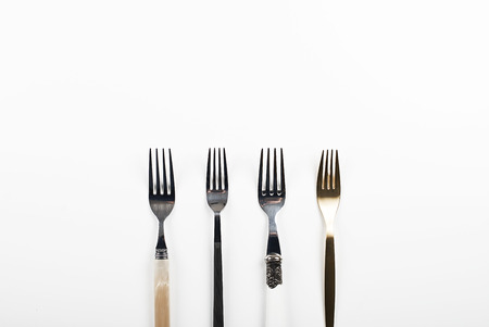 Forks on white background. Copy space.の写真素材