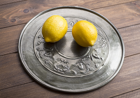 Lemons on metal tray.の写真素材