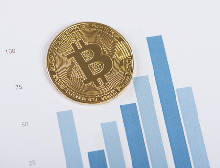 Bitcoin currency on business graphs. Cryptocurrencyの写真素材