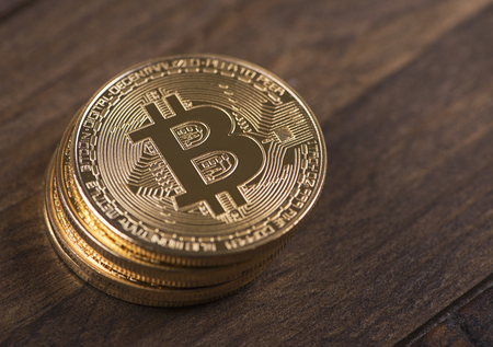 Bitcoin coins on brown wood. Cryptocurrencyの写真素材