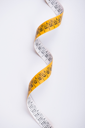 Measuring tape on white background. Isolated.の写真素材