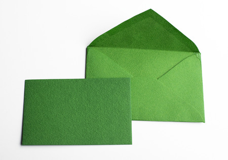 Letter and green card on white background. Mockup.の写真素材