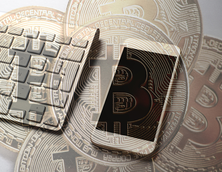 Bitcoin concept on keyboard and smartphone. Concept.の写真素材