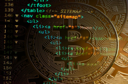 Bitcoin concept next to lines of code. Blockchain conceptの写真素材