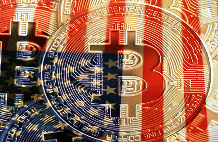 Concept of Bitcoin and United States with a Bitcoin coin next to the US flag.の写真素材