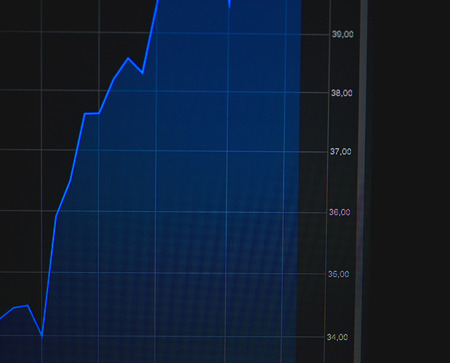 Numbers and graphs that reflect the quote in the forex market in blue, red and white colors. Investment in stock market. Trading conceptの写真素材