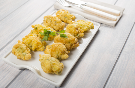 Cod fritters with cutlery. Spanish food.の写真素材