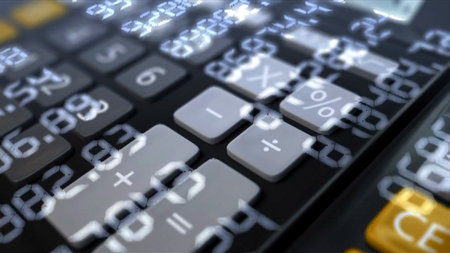 A detailed closeup view of a modern calculator showcasing its clear digital display featuresの写真素材