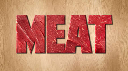 Meat word covered with raw meat texture on a wooden cutting boardの写真素材