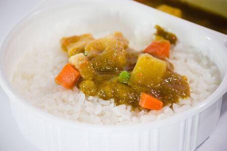 Take away food, Thai curry Massaman with rice isolated on whiteの写真素材
