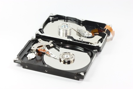 pair of  hard disk compair between  sata harddisk in front  and ide harddisk back one  on white...