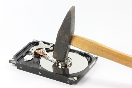 hard disk with hammer at the top on white backgound