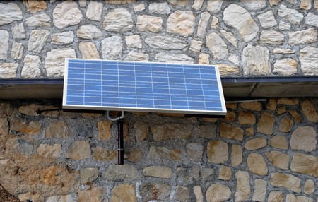 solar panels to produce electricity from sunlight throughの写真素材