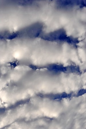blue sky with white fluffy clouds background textureの写真素材
