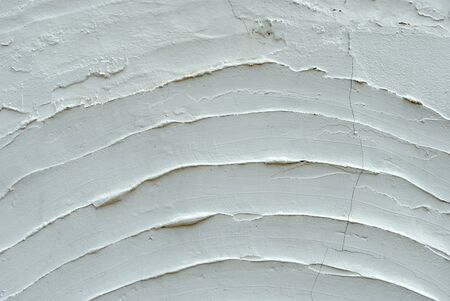 texture with white cement and plaster bas relief lines and spatulaの写真素材