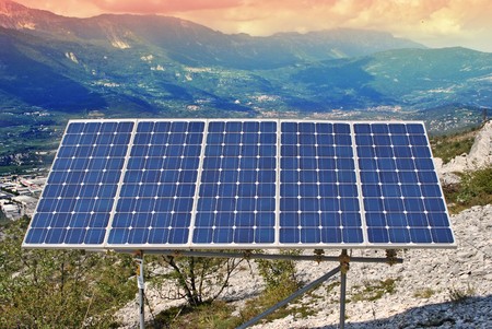Solar Panel with background blue sky and white cloudsの写真素材