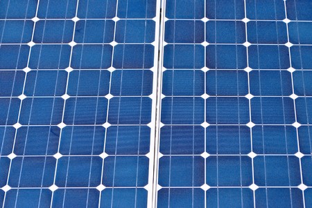 Solar Panel with background blue sky and white cloudsの写真素材