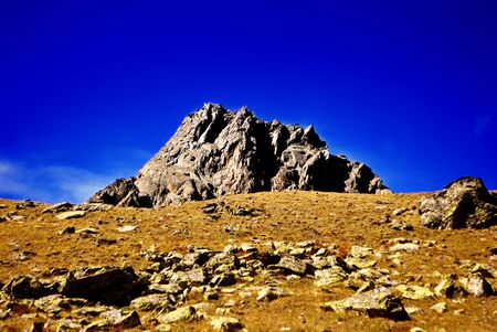 mountains without vegetation and blue sky backgroundの写真素材