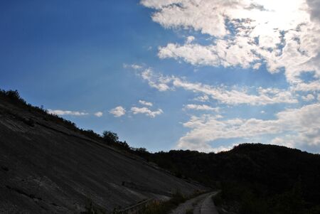 blue sky with white clouds and black