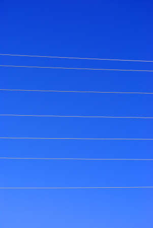 wires with blue skyの写真素材