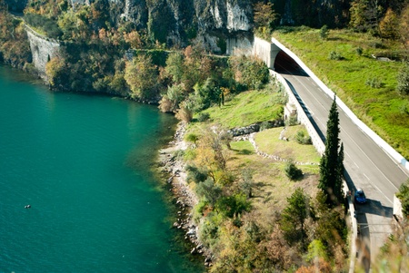 paved road with lake and mountainの写真素材