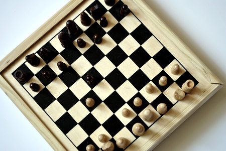 light wooden chessboard on white background