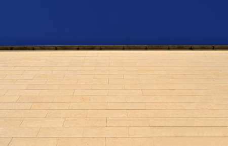 modern building with stone slabs, blue sky backgroundの写真素材