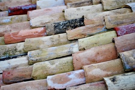 terra cotta tiled roof with view of sky with cloudsの写真素材