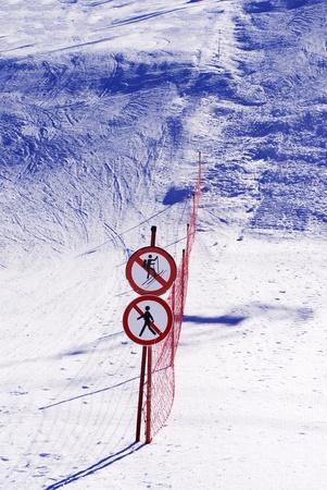 skiers on ski slope with a snowboard の写真素材