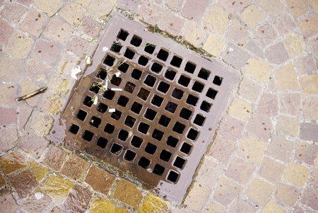 gutter to collect rainwater, sewer lid の写真素材
