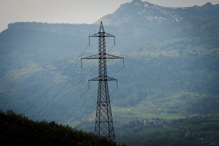 Electricity pylons with long cable at day