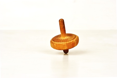 Humming or spinning top in motion on white background